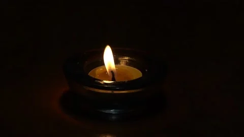 Meditation candle flame on a black background Stock Footage 230332015