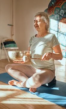 Meditation, elderly woman and mindfulness, zen and yoga in fitness studio with Stock Photos