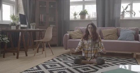 Meditation at home on the carpet Stock Footage 154337232