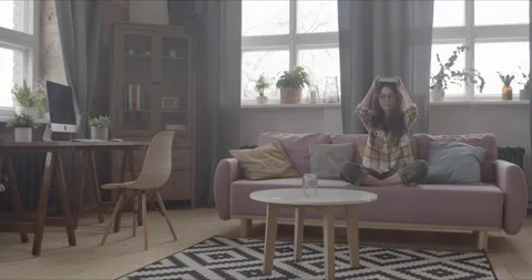 Meditation at home on the couch Stock Footage 154336754