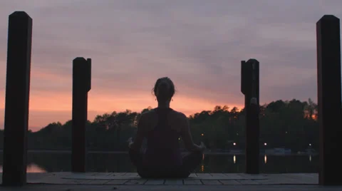 Meditation by a Lake at Sunset Stock Footage
