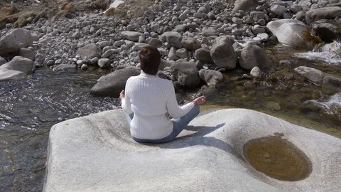 Meditation at the mountain river Stock Footage 87644572