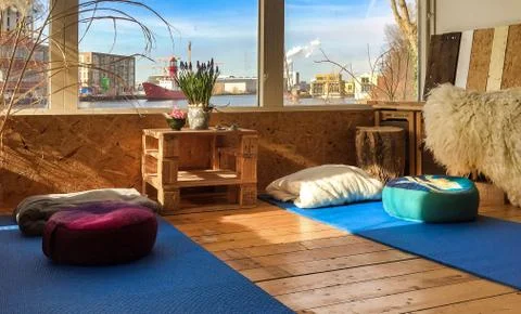 Meditation or yoga mats on floor of houseboat Stock Photos