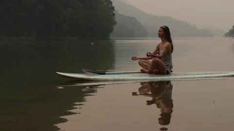 Meditation on paddleboard Stock Footage 62087047