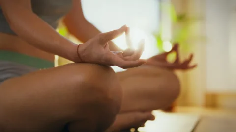 Meditation practice in a serene indoor setting with natural light Stock Footage 300385564