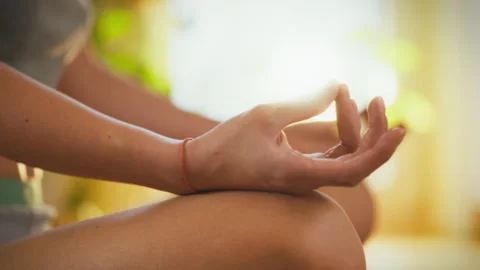 Meditation practice in a sunlit space for mindfulness and relaxation Stock Footage 303649264