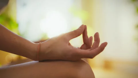 Meditation practice in a sunlit space promoting mindfulness and tranquility 스톡 동영상 299037285