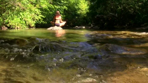 Meditation on a river - HD Stock Footage 778725
