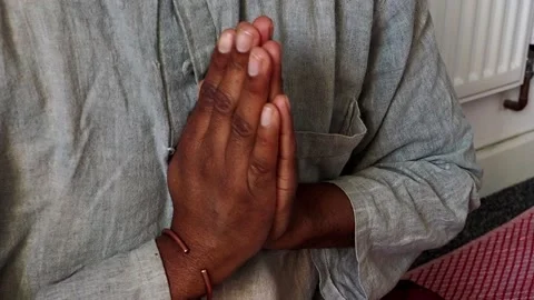 A meditator with hands clasped together in a prayer position Video stock 227528008