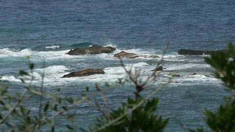 A mediterranean bay in a cloudt day with rough sea - telephoto Stock Footage 97350437