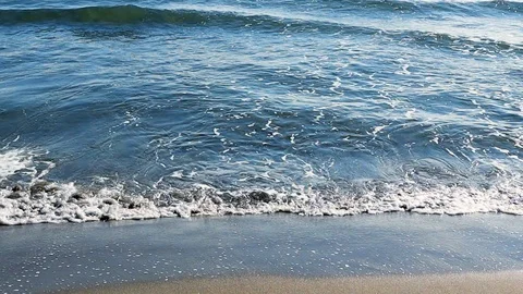 Mediterranean beach waves on beach at eavning time , sunlight reflect on water Stock Footage 105973840
