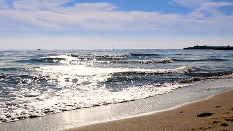 Mediterranean beach waves on beach at eavning time , sunlight reflect on water Stock Footage 105973850