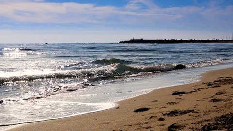 Mediterranean beach waves on beach at eavning time , sunlight reflect on water Stock Footage 105973886