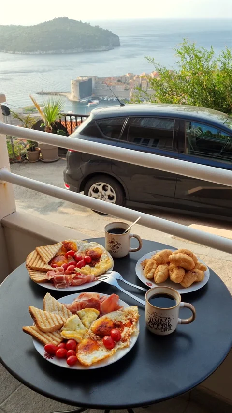 Mediterranean breakfast on balcony overlooking Lokrum island Dubrovnik. Stock Footage 341341279