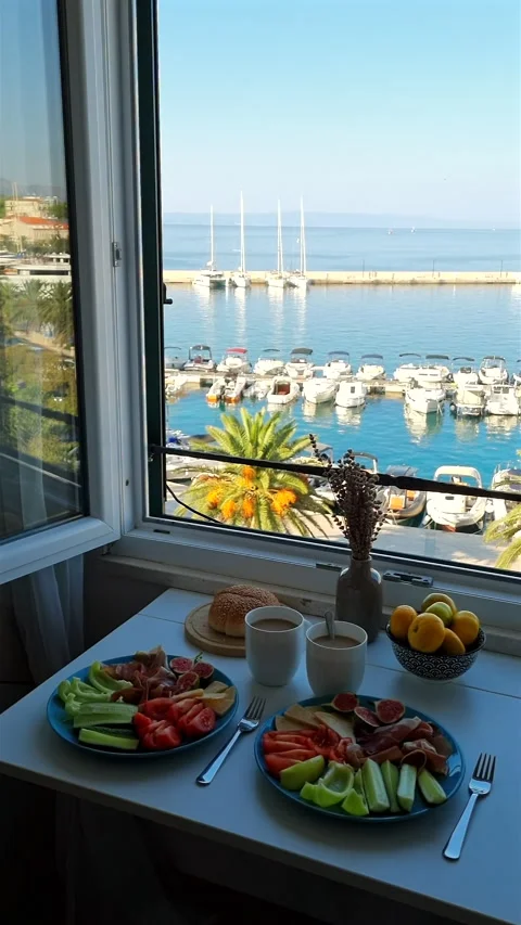Mediterranean breakfast spread with prosciutto, cheese, figs by sea. Video stock 344963515