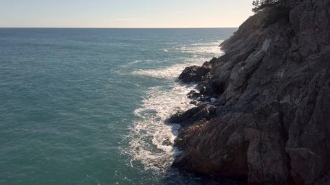 Mediterranean coast scenery with waves hitting the rocks of the big cliffs. Stock Footage 121849298