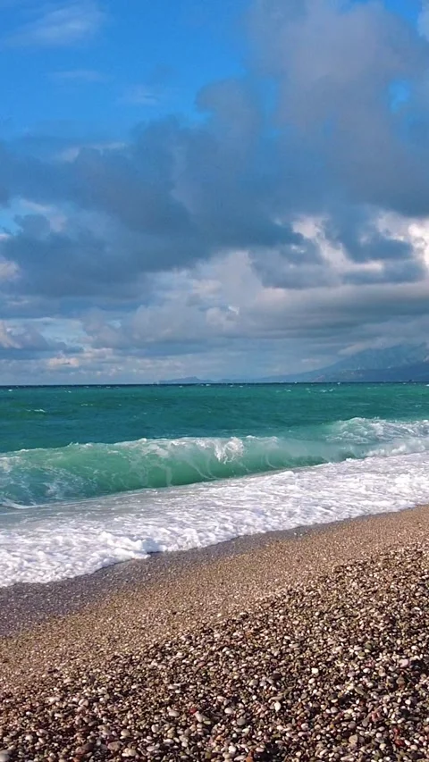 Mediterranean Coastline with Waves and Distant Taurus Mountains Video stock 323610070