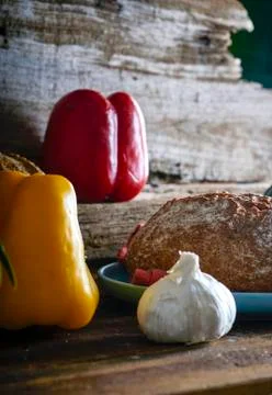 Mediterranean diet. Bread with vegetables composition in a wooden table Foto stock