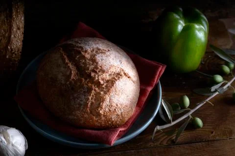 Mediterranean diet. Bread with vegetables composition in a wooden table Stock Photos