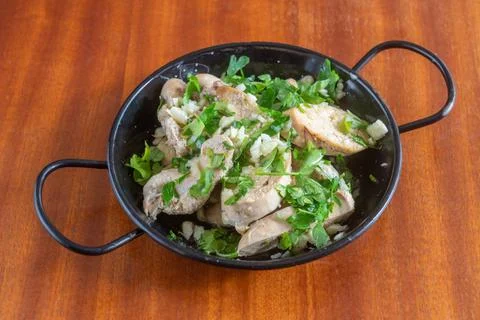 Mediterranean dish appetizer of boiled cod roe marinated in olive oil and Stock Photos