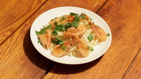 Mediterranean dish of spaghetti with shrimps Stock Footage 74680558