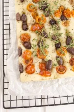 Mediterranean flat bread on cooling rack Stock Photos