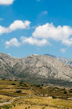 Mediterranean landscape with mountains and fields and blue sky Stock Photos