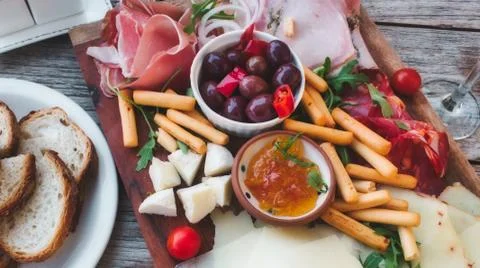 Mediterranean mixed platter to share with a selection of meats and cheeses Stock Photos