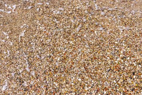 Mediterranean Pebble Beach Stone Texture Waves Water Bar Montenegro. Stock Photos
