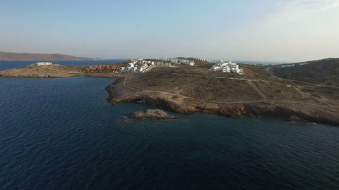 Mediterranean peninsula with small settlement, white buildings, dusty roads Stock Footage 87083575