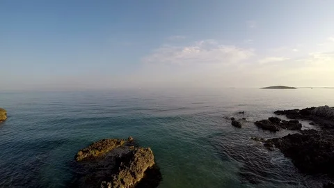 Mediterranean rocky beach at sunset Stock Footage 89324428