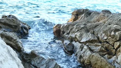 Mediterranean Sea lapping at rocks Stock Footage 148791419