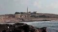 Mediterranean sea near Faros beach with lighthouse, Paphos, Cyprus HD Footage