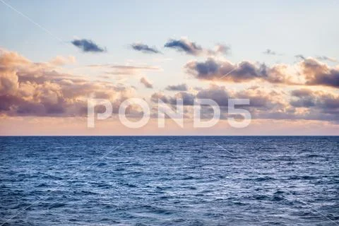 Mediterranean sea. Sunset with differently shaped clouds. Malta. Stock Photos