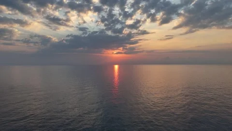 Mediterranean Sea sunset with dramatic golden light and cloud formations 動画素材 337140205