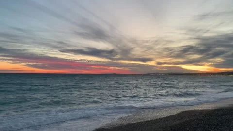 Mediterranean sea waves. Red sky. View from Promenade des Anglais. Nice, France Stock Footage 265257500