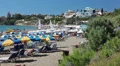 Mediterranean seaside with sunbathing people in Coral Bay, Paphos, Cyprus HD Footage