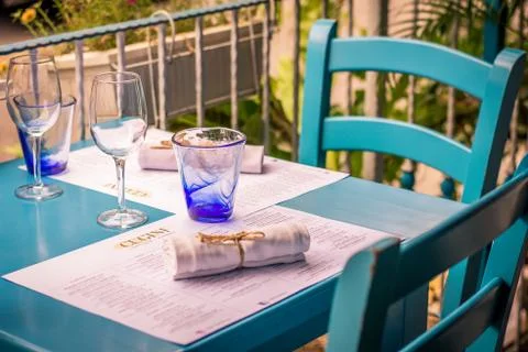 Mediterranean style restaurant with table setting and tableware Stock Photos