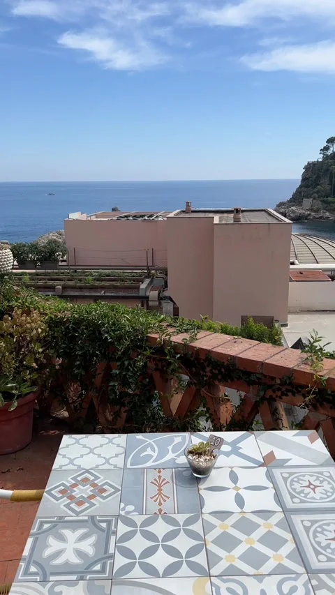 Mediterranean terrace with ceramic tile table view of Taormina sea HD vertical Stock Footage 341942705