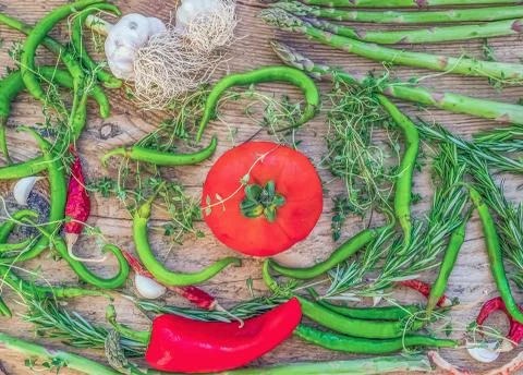 Mediterranean vegetable set consisting of garlic, tomato, fresh herbs, green  Stock Photos