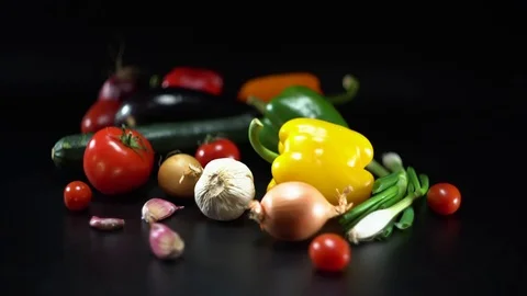 Mediterranean vegetables on black, shallow Depth of field Video stock 75885530