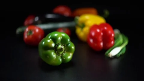 Mediterranean vegetables on black, shallow focus on green capsicum 스톡 동영상 75882852