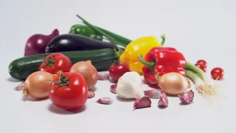 Mediterranean vegetables on white background, panning movement Video stock 75871913