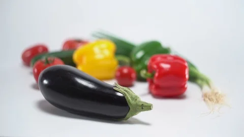 Mediterranean vegetables on white, shallow focus on egg plant 스톡 동영상 75857504