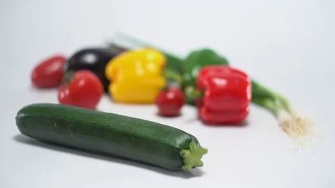 Mediterranean vegetables on white, shallow focus on zucchini Video stock 75858472