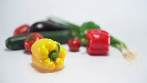 Mediterranean vegetables on white, shallow focus on yellow capsicum 스톡 동영상 75867692