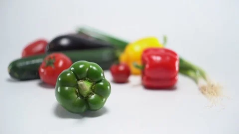 Mediterranean vegetables on white, shallow focus on green capsicum Video stock 75898060