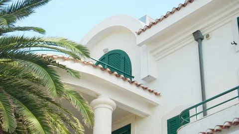 Mediterranean Villa with Lush Palms. Stock Footage 257135943