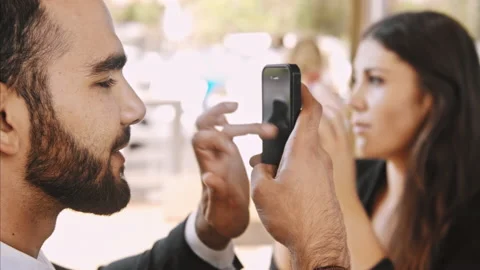 Medium 4k video of middle eastern using app, with hand gestures on smartphone in Vídeos de archivo 201093865