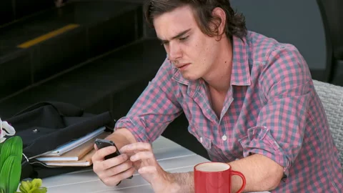 Medium 4k video of young casual man using app, with hand gestures on smart phone Stock Footage 201096621